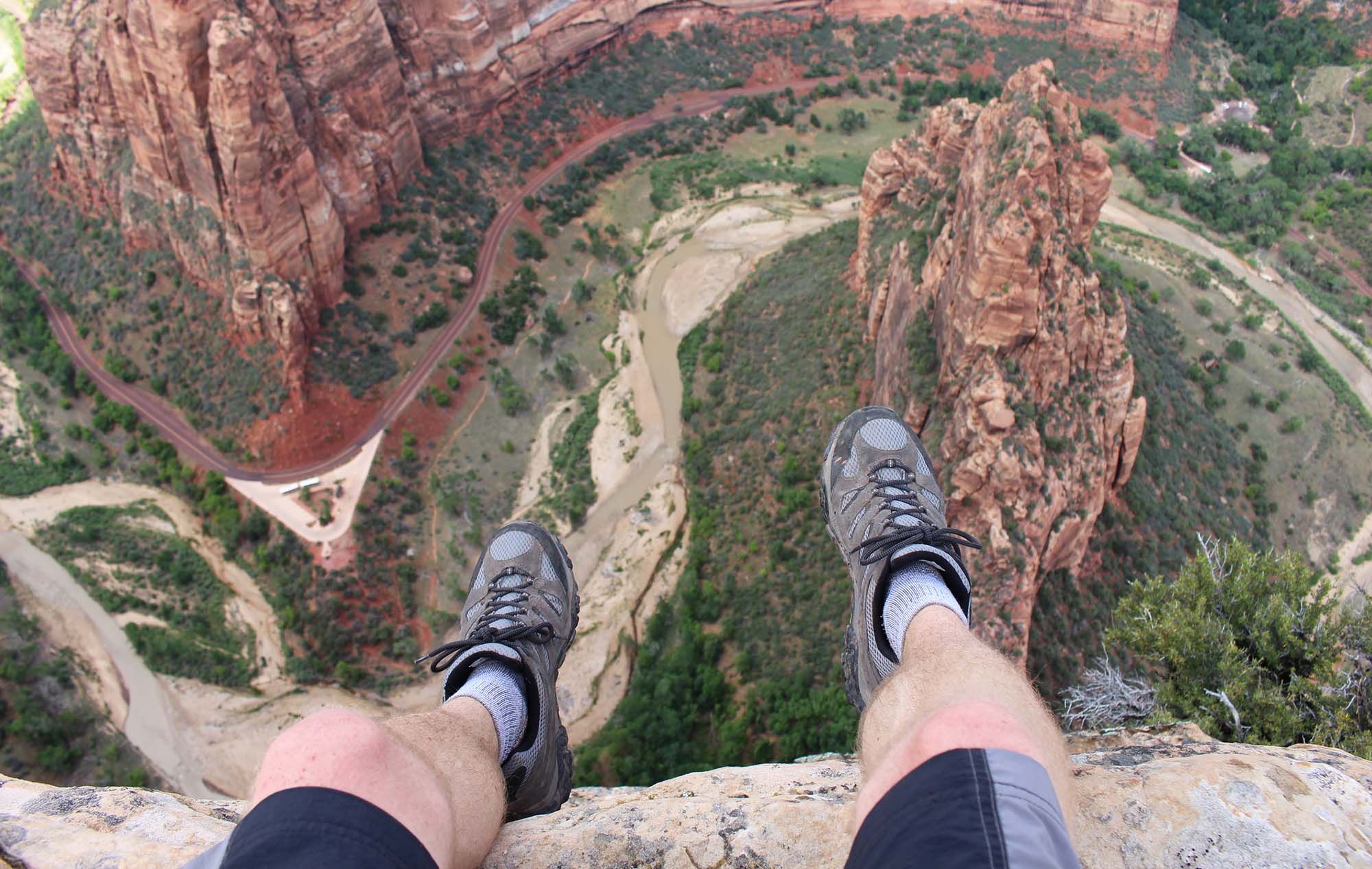 Man sitting on a cliffs edge