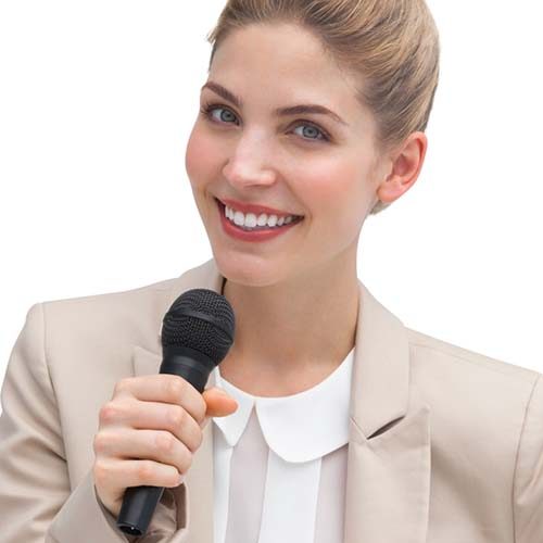 Businesswoman public speaking with microphone