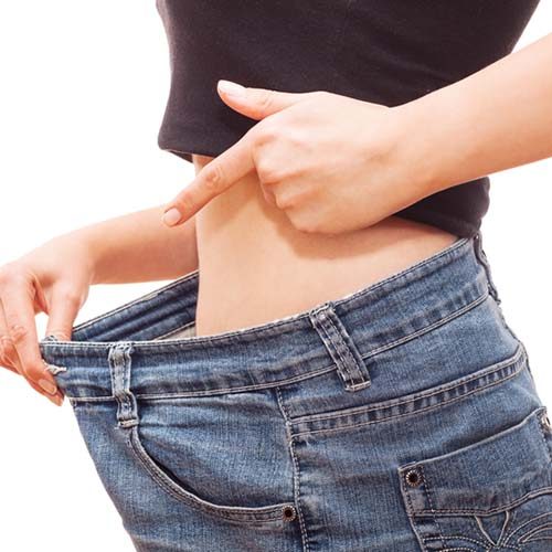 woman loosing weight Woman showing her success after loosing weight